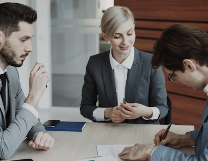 A deal team around a table