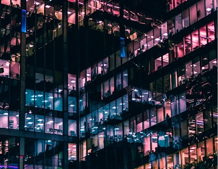 An office tower lit at night