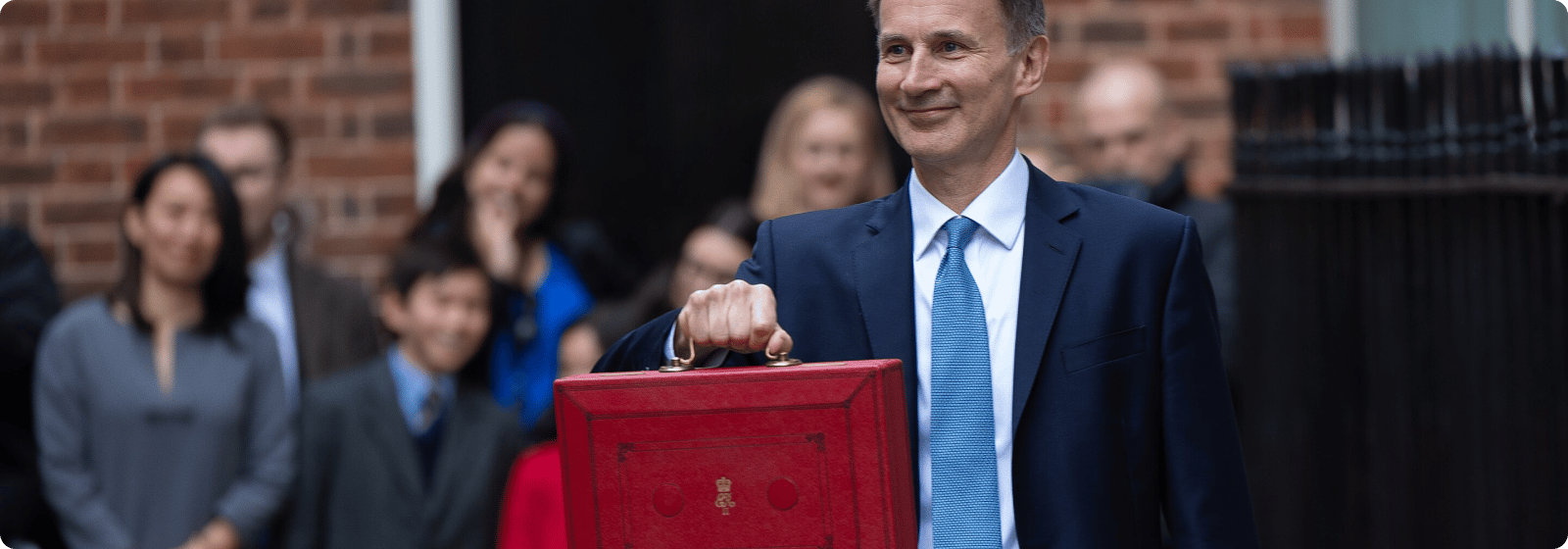 Jeremy Hunt holds budget briefcase at Spring Budget 2023